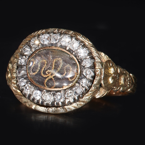 172 - GEORGIAN DIAMOND RING, the center with hair work and gold wire work. Surrounded with diamonds. The s... 