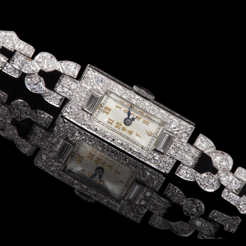 38 - ART-DECO DIAMOND WRISTWATCH, Set with diamonds totalling approx. 2 ct. Manual winding. L. 17 cm. 21.... 
