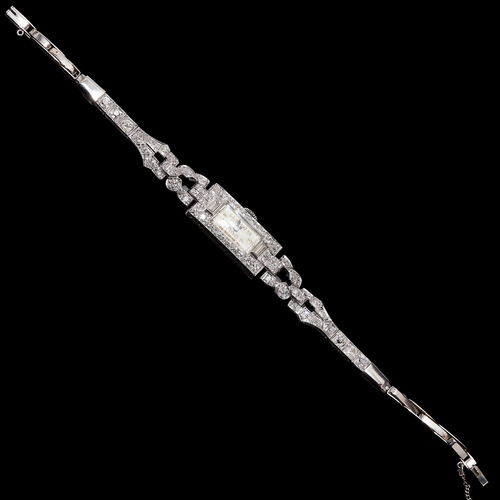 38 - ART-DECO DIAMOND WRISTWATCH, Set with diamonds totalling approx. 2 ct. Manual winding. L. 17 cm. 21.... 
