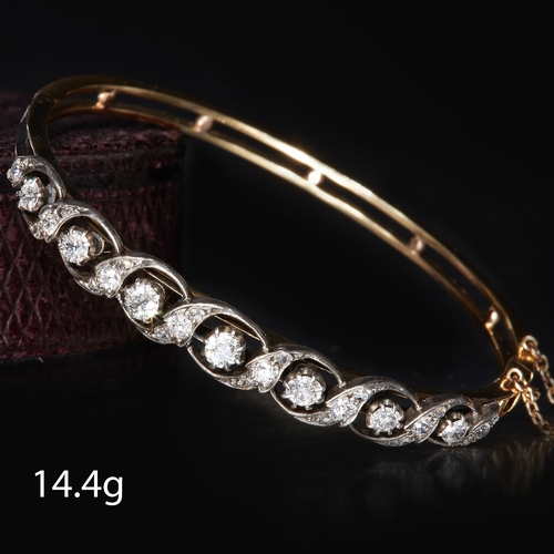 42 - FINE EDWARDIAN DIAMOND SET HINGED BANGLE. set with bright lively graduated diamonds. testing as gold... 