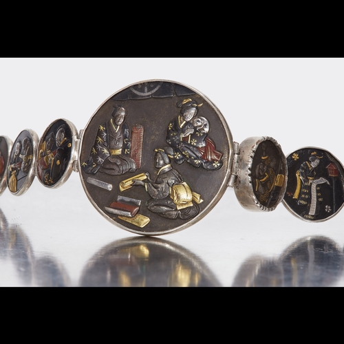 8 - LATE 19TH CENTURY SILVER MOUNTED SHAKUDO BRACELET. set with seven panels depicting Japanese scenery.... 