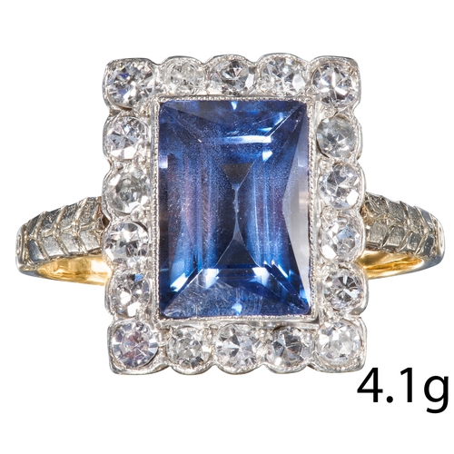 33 - SAPPHIRE AND DIAMOND CLUSTER RING, 
High carat gold and platinum.
Vibrant blue sapphire of approx. 3... 