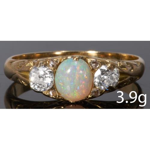 37 - ANTIQUE OPAL AND DIAMOND THREE STONE RING.
18 ct. gold.
Set with an opal of great play of colour.
Br... 