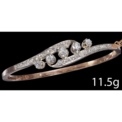 40 - ANTIQUE DIAMOND TWISTED HINGED BANGLE
High carat gold.
Diamonds totalling approx. 1.45 ct. H-J colou... 