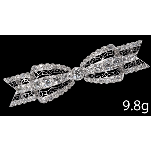 54 - ART DECO DIAMOND BOW BROOCH.
Testing platinum.
Set with bright and lively diamond totalling approx. ... 