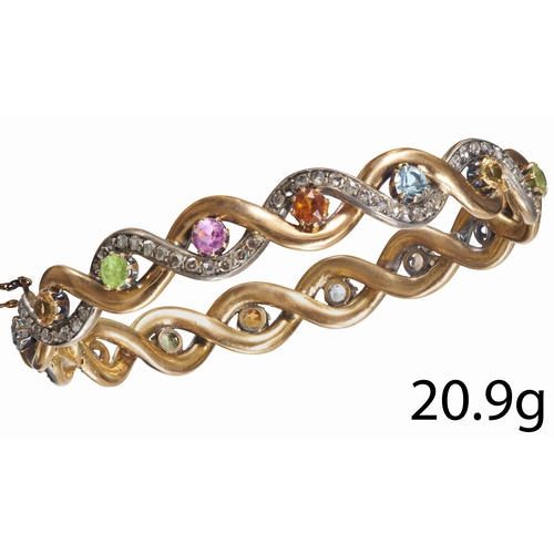 139 - VERY FINE DIAMOND AND MULTI-GEMSTONE HINGED BANGLE,
High carat gold and silver, French.
Entwined des... 