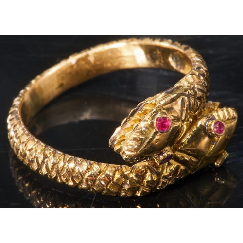 153 - FINE ANTIQUE RUBY DOUBLE SNAKE RING,
High carat gold.
Ruby eyes accents.
The ring all around with fi... 