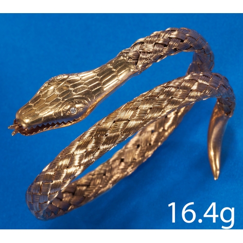 155 - FINE ANTIQUE DIAMOND SNAKE SPRUNG BANGLE,
High carat gold.
Diamond eyes.
Fine woven link design.
Inn... 