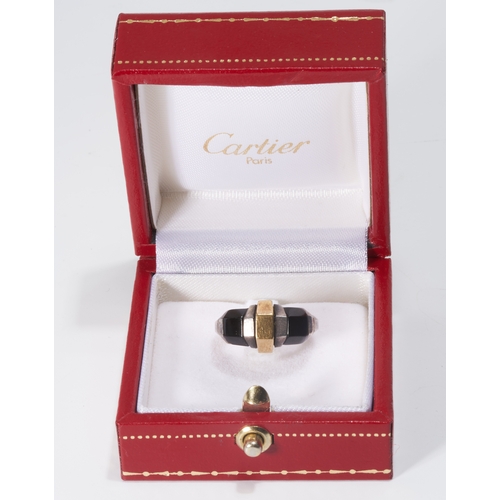 53 - CARTIER, RARE AND UNUSUAL GOLD, SILVER AND ONYX RING.
INSPIRED BY JEAN DESPRES.
18 ct. gold.
Signed ... 