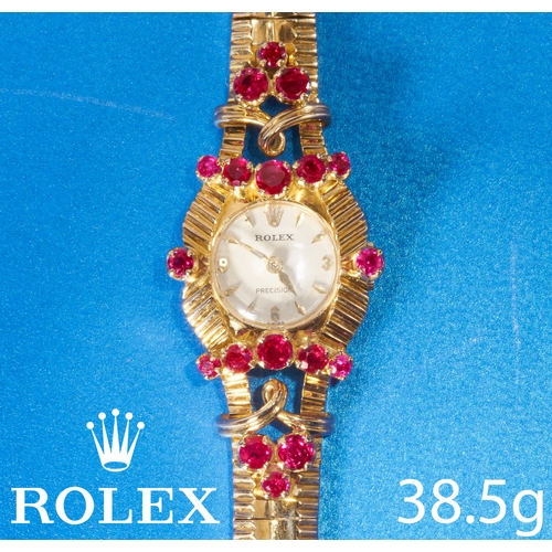 88 - ROLEX, FINE RUBY SET WRISTWATCH.
18 ct. gold.
Rolex, precision.
Manual winding.
Rich and vibrant rub... 