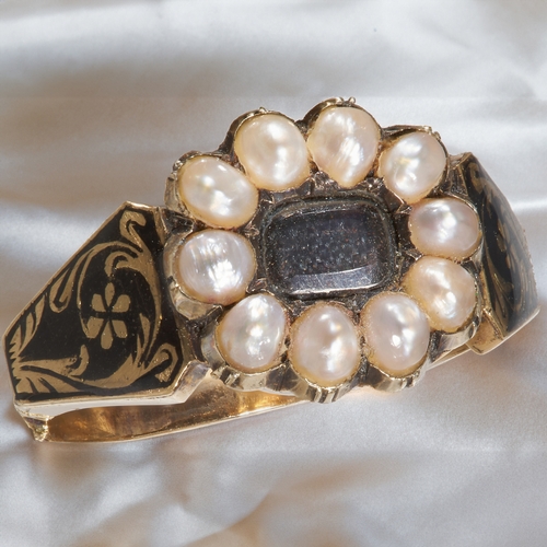 128 - GEORGIAN PEARL AND ENAMEL MEMORI RING, 
In high carat gold.
Pearls well matched.
Enamel in great con... 