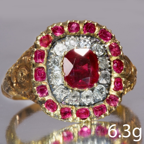 32 - RUBY AND DIAMOND CLUSTER RING,
High carat gold.
Center ruby rich and vibrant of approx. 1.05 ct.
Dia... 