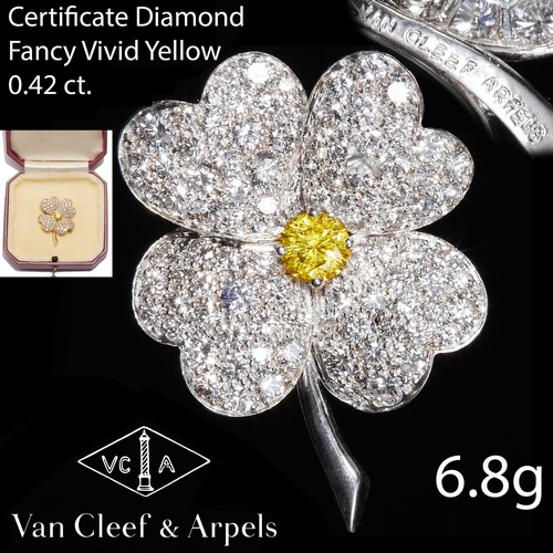 35 - VAN CLEEF & ARPELS 'COSMOS' FANCY VIVID YELLOW AND WHITE DIAMOND BROOCH,
18 ct. gold.
Center diamond... 