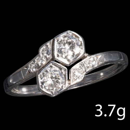 36 - ART-DECO DIAMOND TOI-ET-MOI TWIST RING,
18 ct. gold. 
Set with bright and lively diamonds. 
Size T. ... 