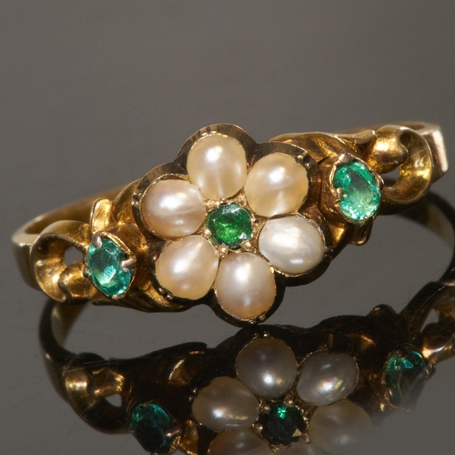 42 - VICTORIAN EMERALD AND PEARL RING
In high carat gold.
Vibrant emeralds.
Locket back.
Size N. 
1.6 gra... 