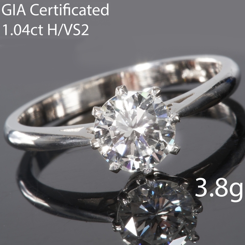 50 - GIA CERTIFICATED 1.04 CT. DIAMOND SOLITAIRE RING, 
Platinum.
Diamond 1.04 ct.
Certificated H Colour,... 