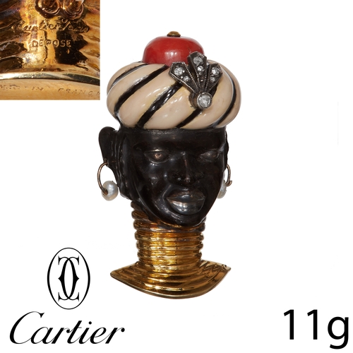 57 - CARTIER, ENAMEL DIAMOND AND CORAL 'BLACKAMOOR' BROOCH,
High carat gold.
The face and turban with ena... 