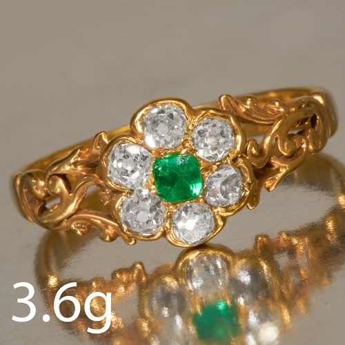 58 - EMERALD AND DIAMOND CLUSTER RING, 
in 18 ct. gold. 
Set with a vibrant emerald
Lively diamonds total... 