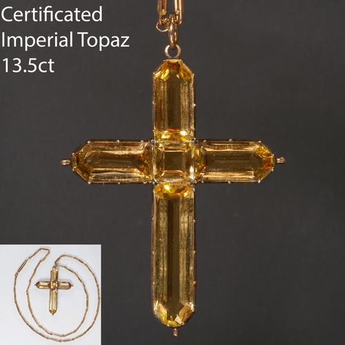 17 - CERTIFICATED IMPERIAL TOPAZ CROSS PENDANT AND A CHAIN.
High carat gold.
Set with vibrant rich topaz ... 