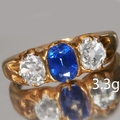 SAPPHIRE AND DIAMOND 3-STONE RING, In high carat gold. Lovely vibrant ...