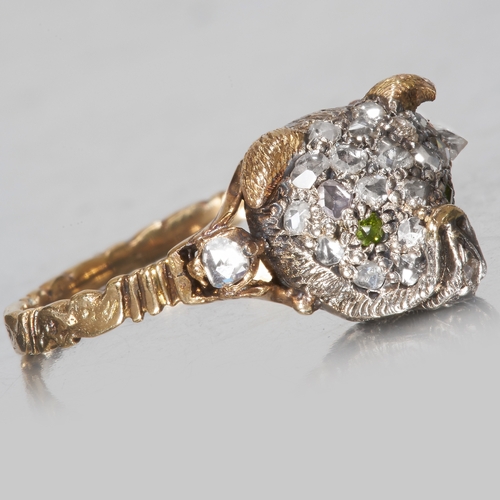 169 - RARE ANTIQUE DIAMOND AND GREEN GARNET DOG RING,
High carat gold.
Presumably depicting a pug.
Diamond... 