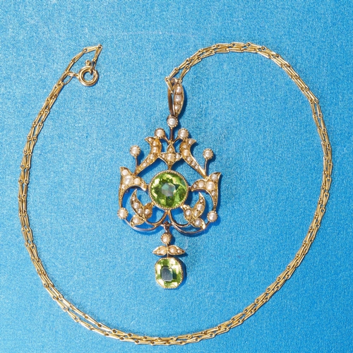 18 - VICTORIAN PERIDOT AND PEARL PENDANT
15 ct. gold pendant. 
Rich and vibrant peridot.
Pearls well matc... 