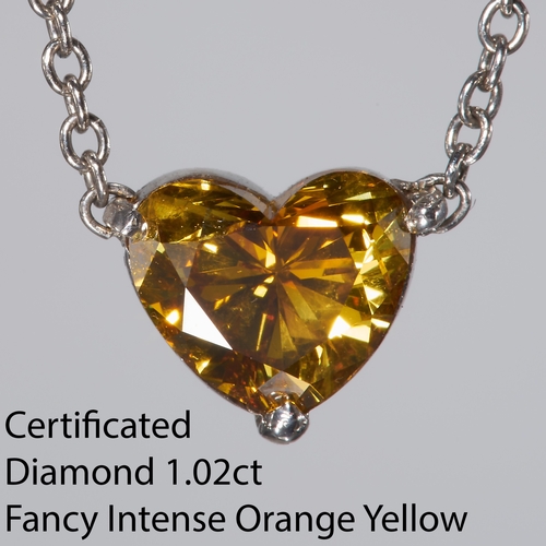 207 - CERTIFICATED FANCY INTENSE ORANGY YELLOW DIAMOND PENDANT NECKLACE, 
The heart shaped diamond of 1.02... 