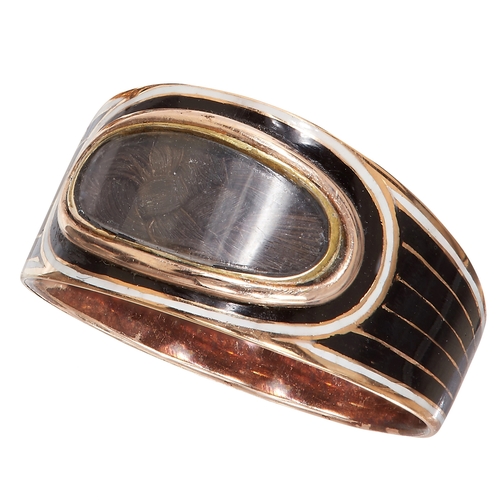 37 - FINE GEORGIAN GOLD AND ENAMEL RING. 
High carat gold.
dated 1820.
Black and white enamel, in good co... 