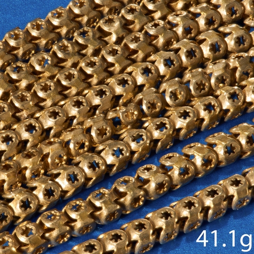 65 - ANTIQUE LONG MUFF CHAIN,
The links with pierced star design.
L. 146 cm.
41.1 grams.