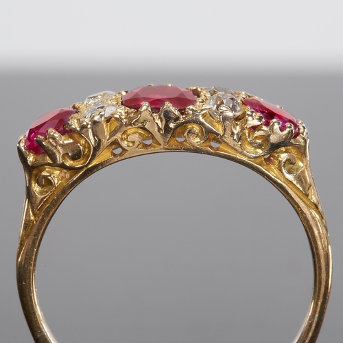 103 - ANTIQUE RUBY AND DIAMOND SEVEN STONE RING.
18 ct gold.
Set with vibrant rich colour rubies.
Bright a... 
