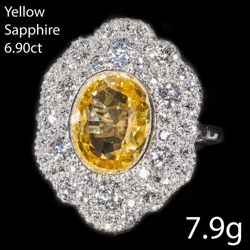 115 - YELLOW SAPPHIRE AND DIAMOND CLUSTER RING,
High carat gold.
Gemstones totalling approx. 9.20 ct.
Rich... 