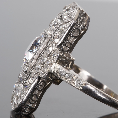 40 - LARGE ART-DECO DIAMOND RING,
platinum.
Diamonds totalling approx. 2.10 ct.
Center diamond 1.10 ct.
B... 