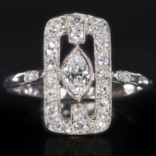 61 - DIAMOND RING,
High carat gold.
Larger marquise shaped diamond to the center.
Diamonds bright and liv... 