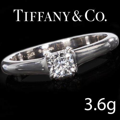 71 - TIFFANY AND CO, SOLITAIRE DIAMOND RING.
Platinum.
Bright and lively diamond.
Singed and numbered Tif... 