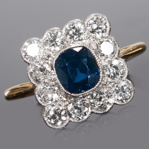 101 - SAPPHIRE AND DIAMOND CLUSTER RING.
18ct gold.
Set with vibrant sapphire and bright and lively diamon... 