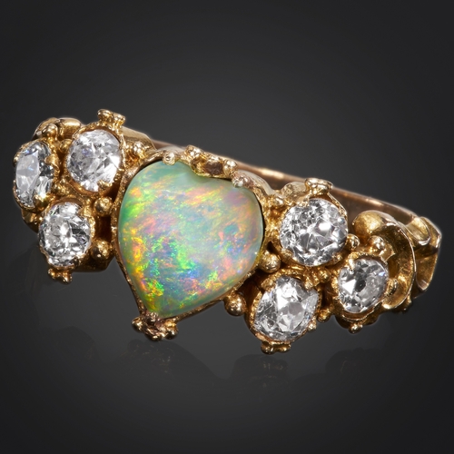 155 - ANTIQUE OPAL AND DIAMOND RING,
High carat gold.
The opal with a good play of colour.
Bright and live... 