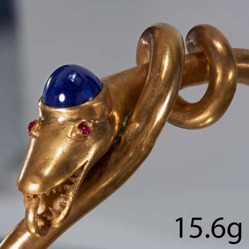 105 - ANTIQUE SNAKE BANGLE,
15.6 grams, High carat gold.
Vibrant sapphire to the head of approx. 2.70 ct.
... 