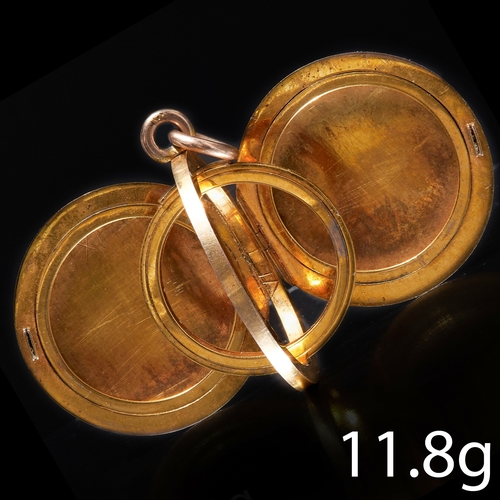 196 - AN UNUSUAL DOUBLE PHOTO LOCKET. 
with revolving center.
2.9 cm diameter. 
11.8 grams.