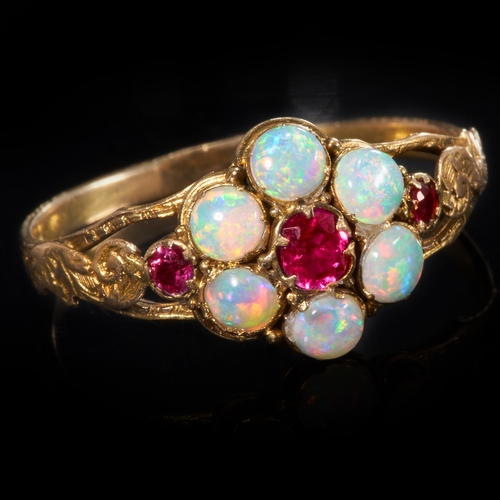 213 - ANTIQUE VICTORIAN RUBY AND OPAL CLUSTER RING,
1.9 grams, testing 14 ct. gold.
Vibrant rubies.
Opals ... 