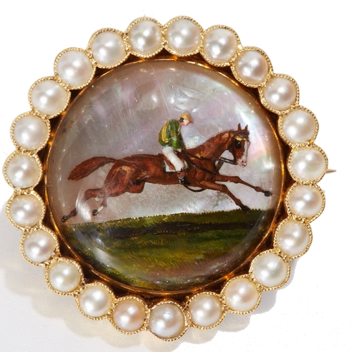 250 - ESSEX CRYSTAL REVERSE INTAGLIO HORSE AND PEARL BROOCH, 
the reverse intaglio 'essex crystal' depicti... 