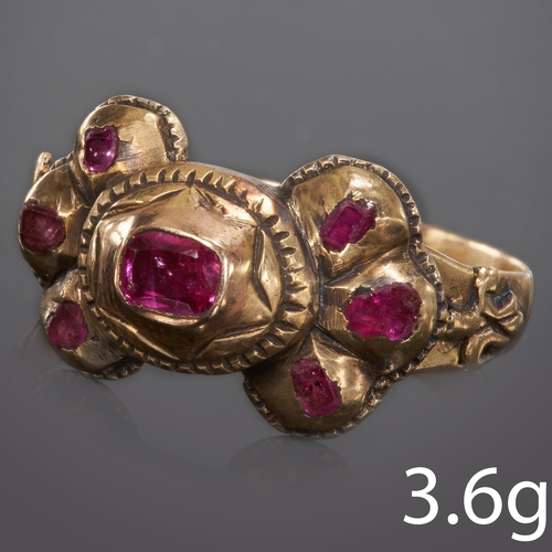 265 - ANTIQUE GEORGIAN RUBY RING,
Possibly 18th century,
3.6 grams, testing 18 ct. gold.
Closed set rubies... 