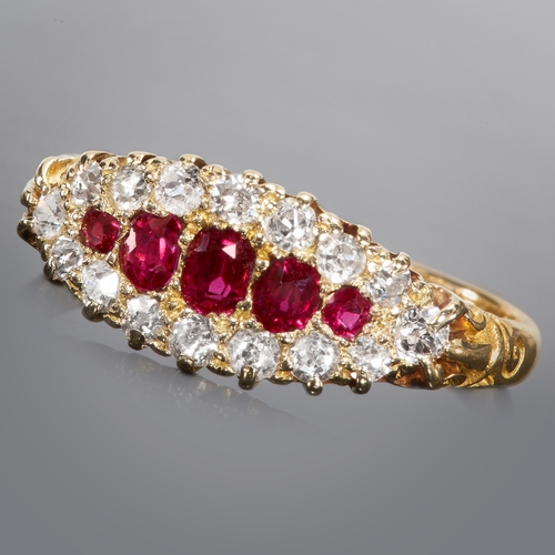 56 - RUBY AND DIAMOND CLUSTER RING.
18 ct. gold.
Set vibrant rich colour rubies.
Bright and lively diamon... 