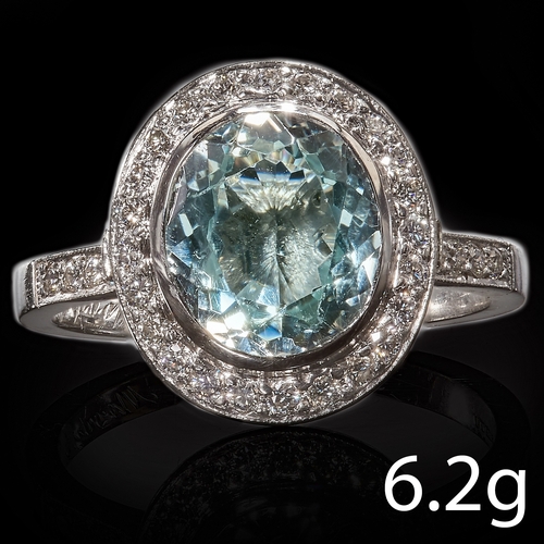 149 - AQUAMARINE AND DIAMOND CLUSTER RING,
6.2 grams, Platinum.
Vibrant aquamarine.
Diamonds bright and li... 