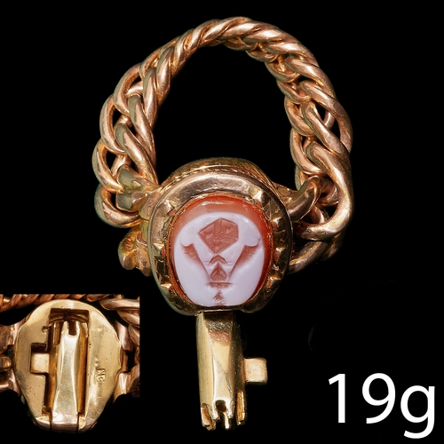 299 - RARE ANTIQUE INTAGLIO HIDDEN KEY RING, 
19 grams, 18 ct. gold. 
Carved intaglio with family crest.
T... 