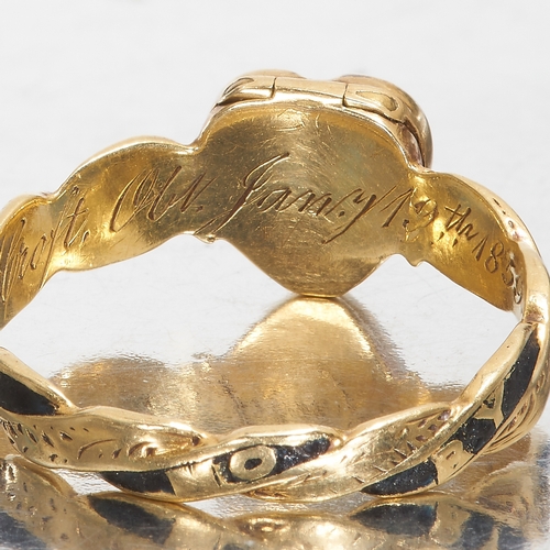 101 - RARE VICTORIAN ENAMEL HEART OPENING MEMORI RING, 1859,
2.7 grams, 18 ct. gold.
The heart and part of... 