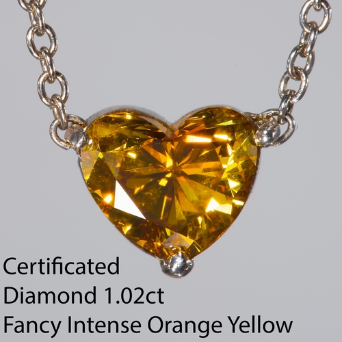 43 - CERTIFICATED FANCY INTENSE ORANGY YELLOW DIAMOND PENDANT NECKLACE, 
The heart shaped diamond of 1.02... 