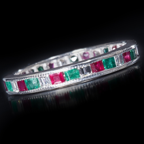 74 - UNUSUAL DIAMOND RUBY AND EMERALD FULL ETERNITY RING
2.6 grams, Testing as platinum.
Vibrant emeralds... 