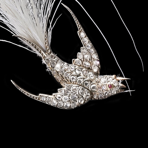 179 - FINE VICTORIAN DIAMOND RUBY AND FEATHER SWALLOW BIRD BROOCH,
8.9 grams.
The body fully set with old ... 