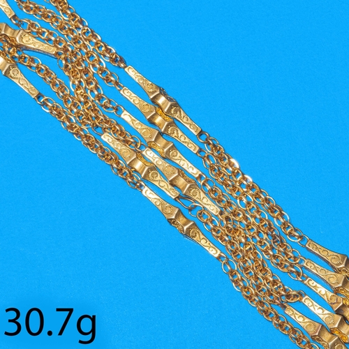 28 - ANTIQUE FANCY LINK LONG GUARD CHAIN,
30.7 grams. Testing 15 ct. gold.
Fine elongated sections betwee... 