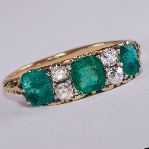 33 - ANTIQUE EMERALD AND DIAMOND SEVEN STONE RING.
2.9 grams.
Total gem weight approx. 1.23 ct.
Set with ... 